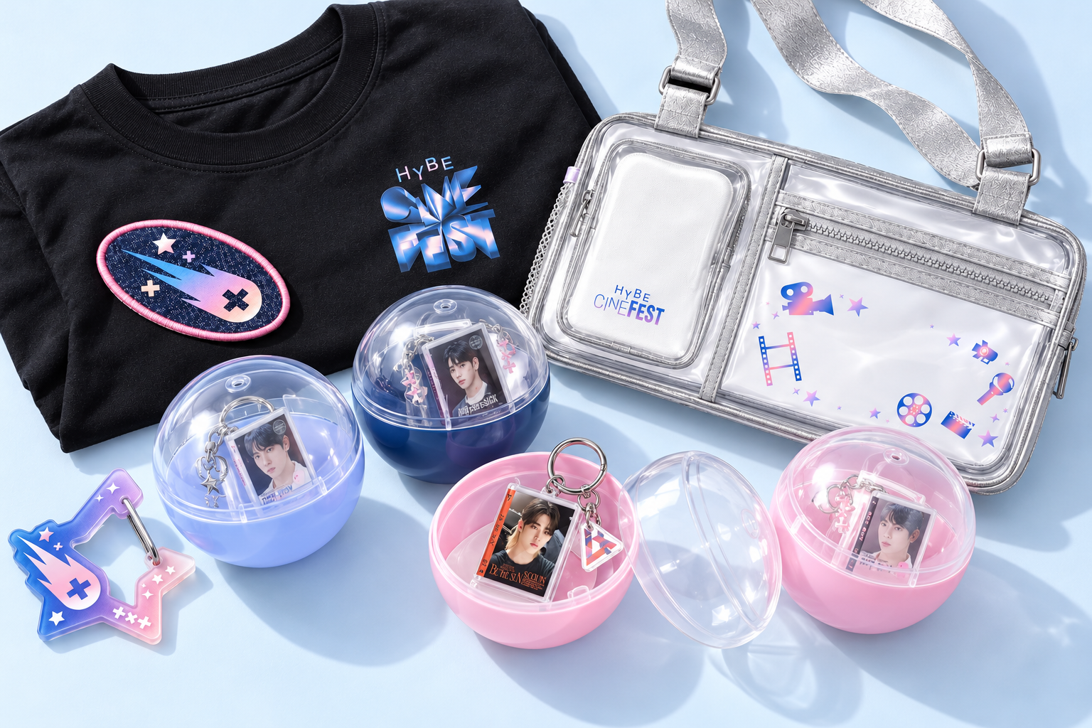 HYBE CINE FEST gacha capsules and merchandise arranged in a bright editorial flatlay